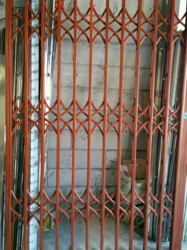 门业图片-铝合金拉闸门木纹色铝合金拉闸门1,225*15图片